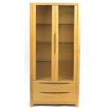 Contemporary light oak Winsor display cabinet with glass doors and two base drawers, 191cm H x