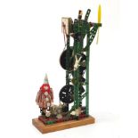 Vintage Meccano motorised clock with propellers and a clown, 43cm high