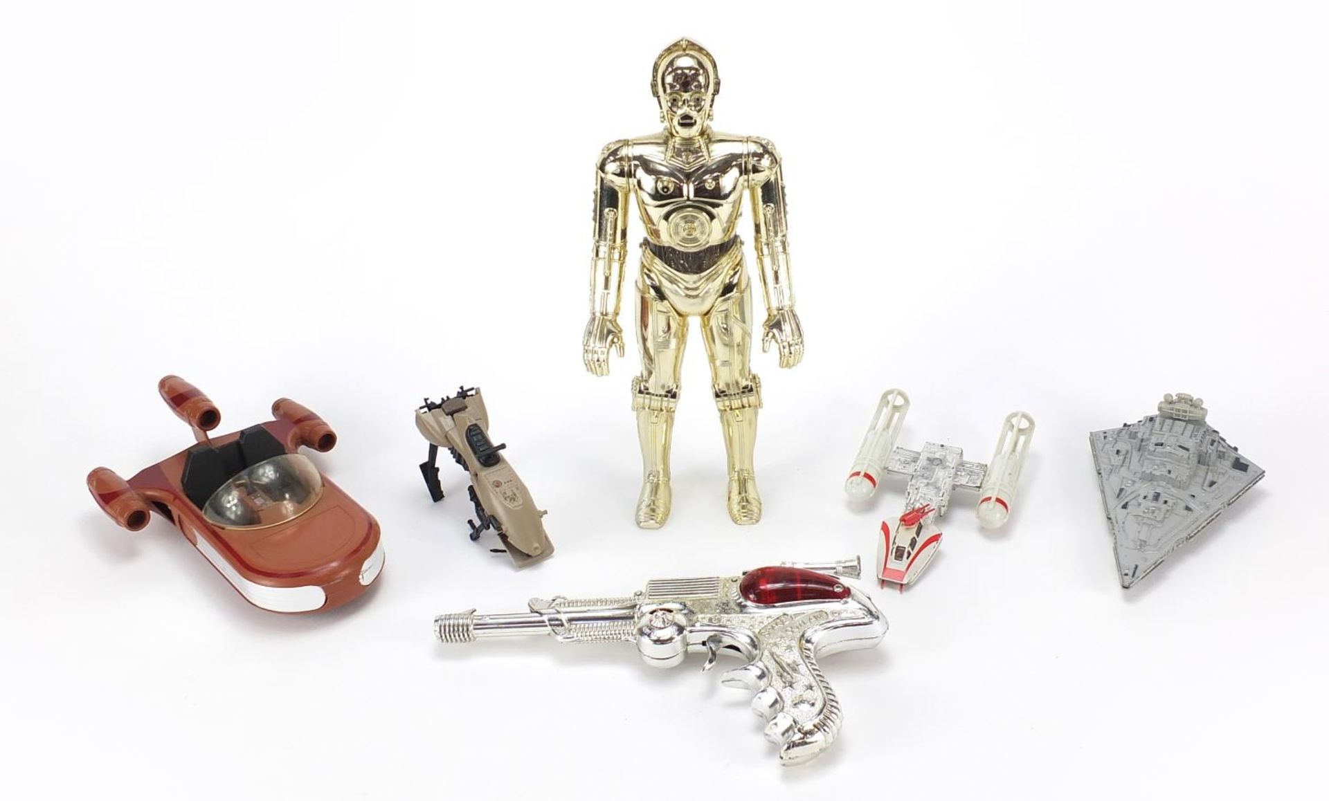 Vintage toys including Space Outlaw diecast gun and large Star Wars C-3PO