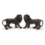 Pair of large patinated bronze standing lions, 30cm in length