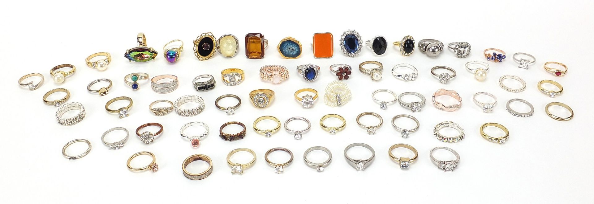 Large selection of costume jewellery rings, some set with colourful stones and glass, various sizes