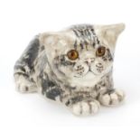 Winstanley pottery recumbent cat with glass eyes, 25cm in length