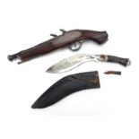 Gurkha's Kukri knife with leather sheath and a decorative flintlock pistol, the pistol 37cm in