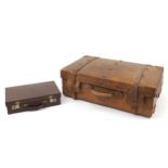 Leather bound suitcase and a briefcase with ER II cypher, the largest 76cm wide