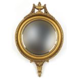 Ornate gilt framed convex mirror with urn, 65.5cm high