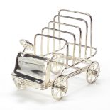 Novelty silver plated five slice toast rack in the form of a car with rotating wheels, 15.5cm in