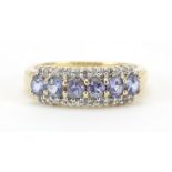 9ct gold tanzanite and diamond half eternity ring, size N, 2.3g