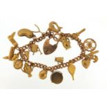 9ct gold charm bracelet with a selection of mostly 9ct gold charms including faith, hope and