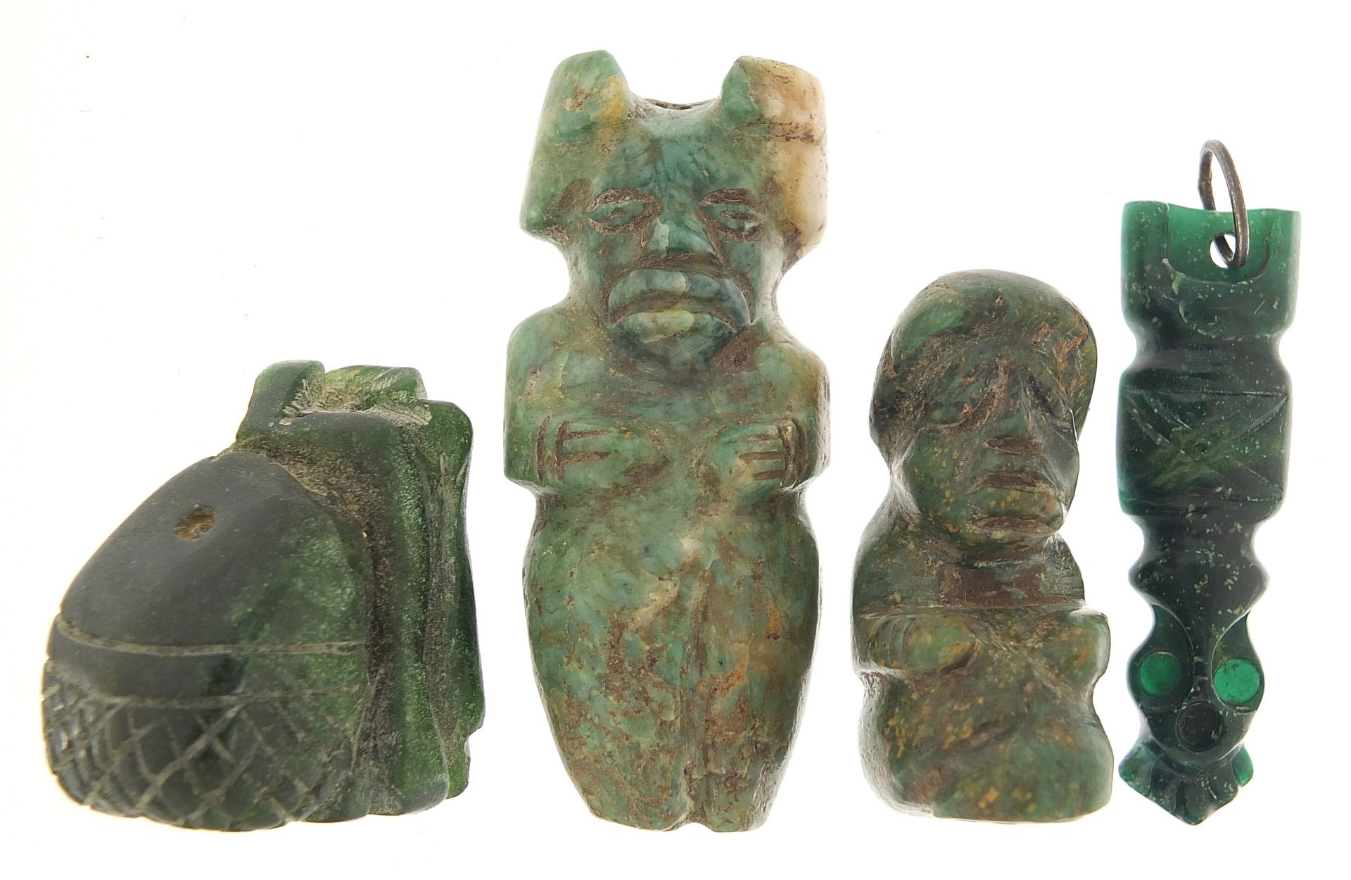 Four antique green stone carvings including a Hei-tiki style pendant, the largest 5.5cm high