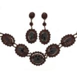 Antique gilt metal garnet cluster necklace and matching earrings, the necklace 50cm in length, the