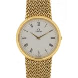 Omega, 18ct gold gentlemen's wristwatch with 18ct gold strap, 31mm in diameter, 71.4g - this lot
