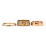 Three 9ct gold wedding bands including one with engraved decoration and one rose gold, sizes L, O