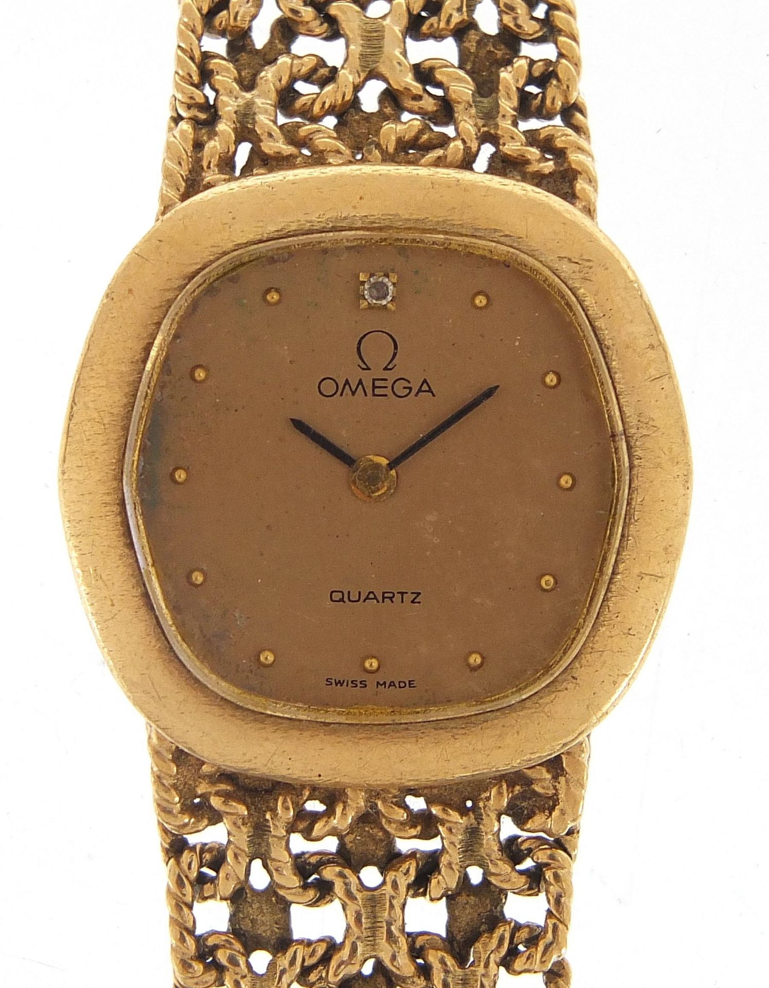 Omega, ladies 9ct gold wristwatch with 9ct gold strap, the case 18mm wide, 36.0g - this lot is