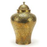 Indian brass vase and cover embossed with figures and animals, 30cm high