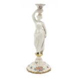 19th century French faience glazed figural candlestick in the form of a scantily dressed female,