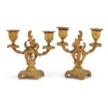 Pair of Rococco style gilt metal two branch candlesticks, each 15cm high
