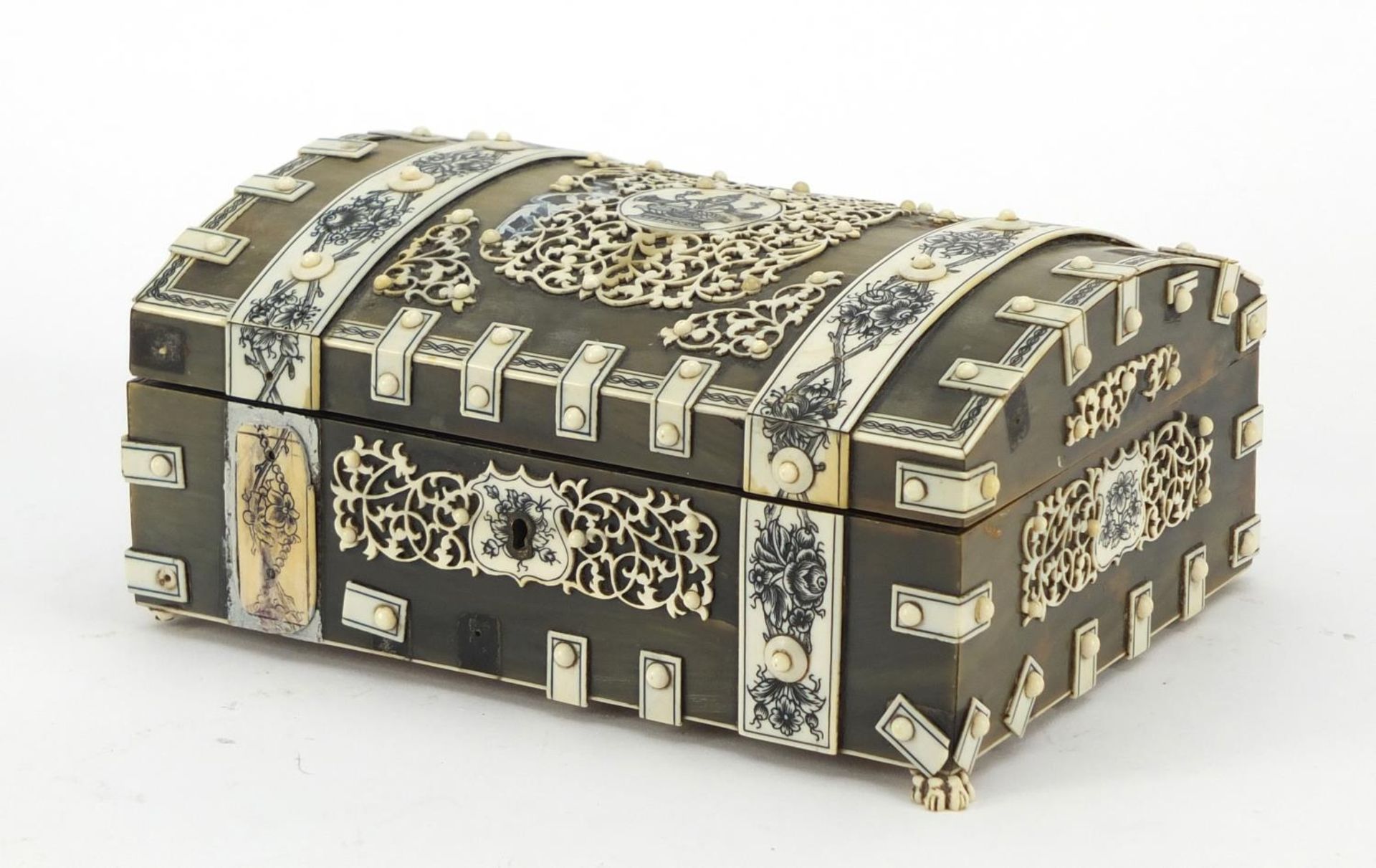 Anglo Indian horn, sandalwood and ivory dome topped casket on paw feet, the ivory penwork panels