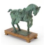 Chinese Verdigris bronzed model of a Tang horse on rectangular wood stand, 27cm in length