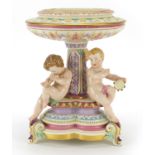 Royal Worcester, Victorian porcelain centrepiece surmounted with three children with instruments,