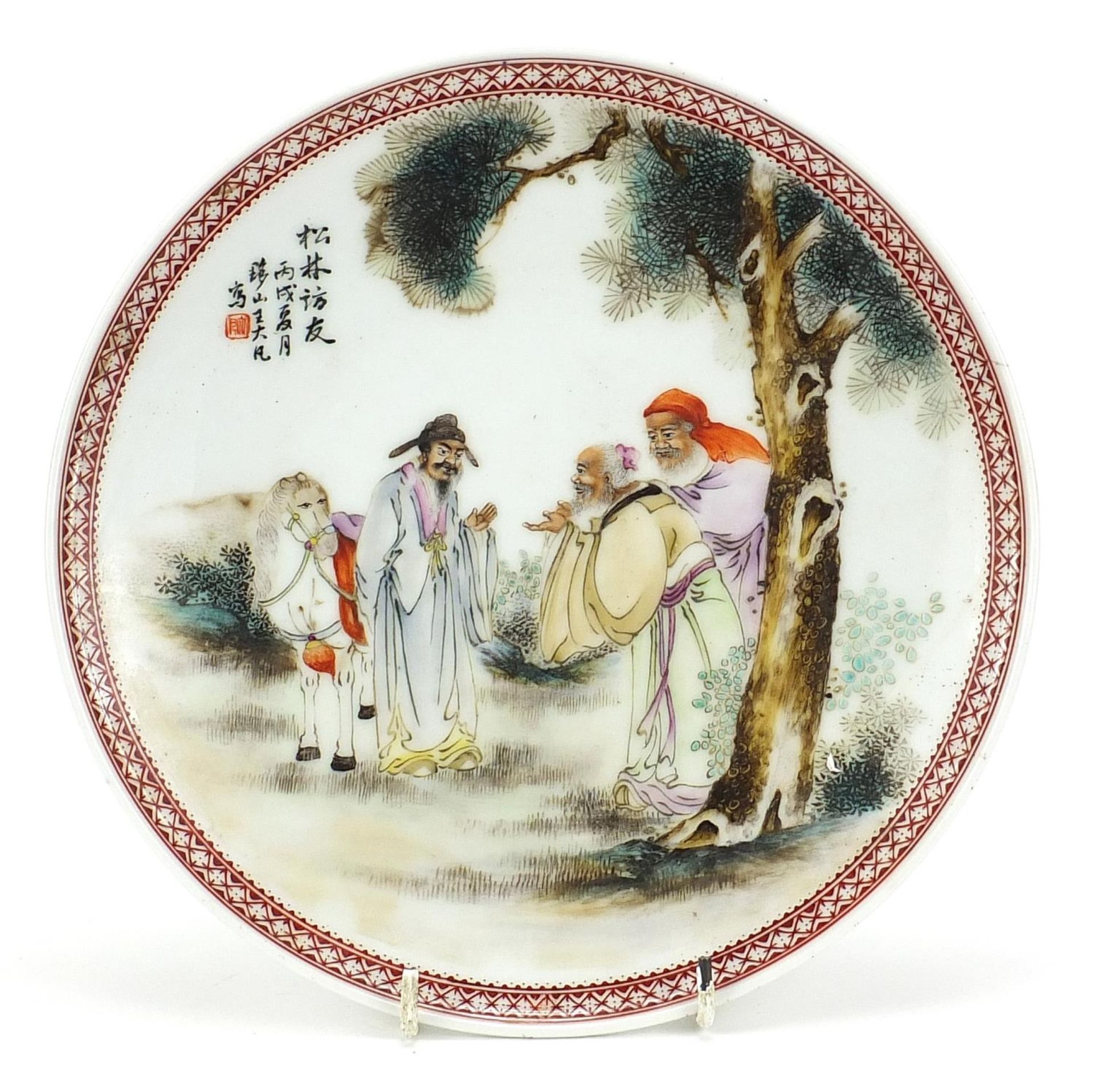 Chinese porcelain footed plate hand painted in the famille rose palette with figures and a horse,