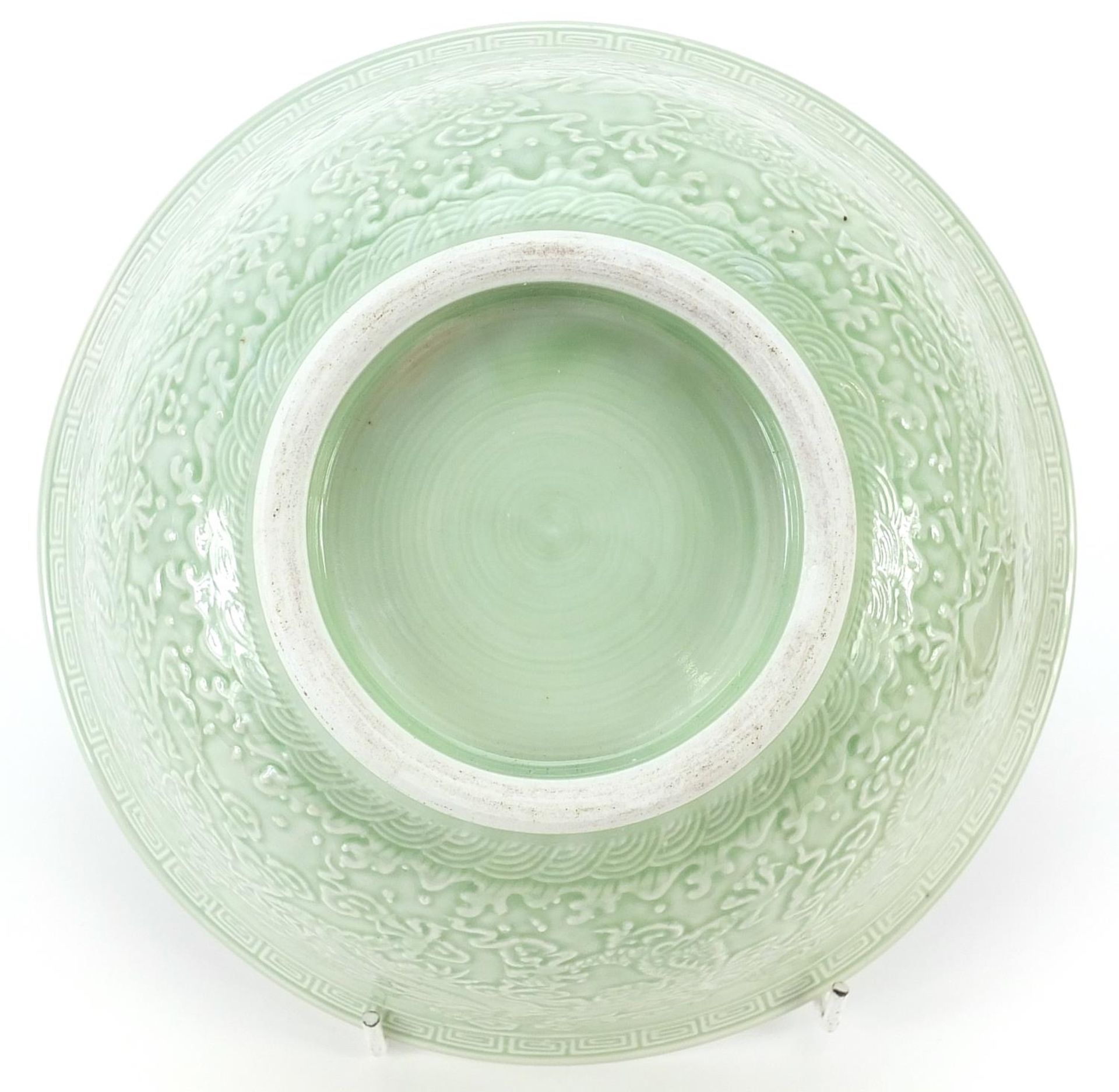 Chinese porcelain bowl raised on hardwood stand having a celadon glaze, decorated in relief with - Image 3 of 3