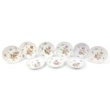 Meissen, nine German porcelain plates hand painted with flowers, each with blue crossed sword