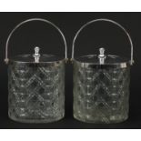 Pair of cut glass biscuit barrels with silver plated lids and swing handles, 15cm excluding the