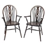 Pair of oak wheel back carver chairs, 98cm high