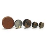 Four Victorian and later freshwater fishing reels including two miniature brass examples, the