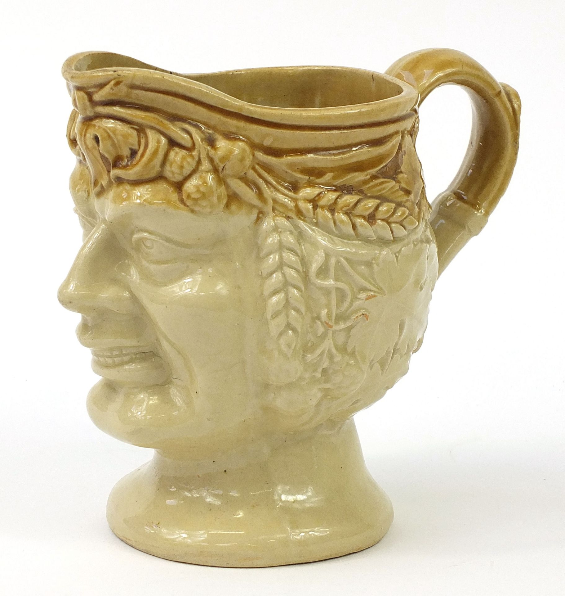 Large stoneware jug in the form of a female bust with grapes and wheat in her hair, 23.5cm high