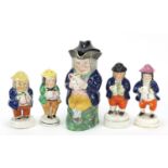 19th century Staffordshire pottery including four figural sifters, the largest 20cm high