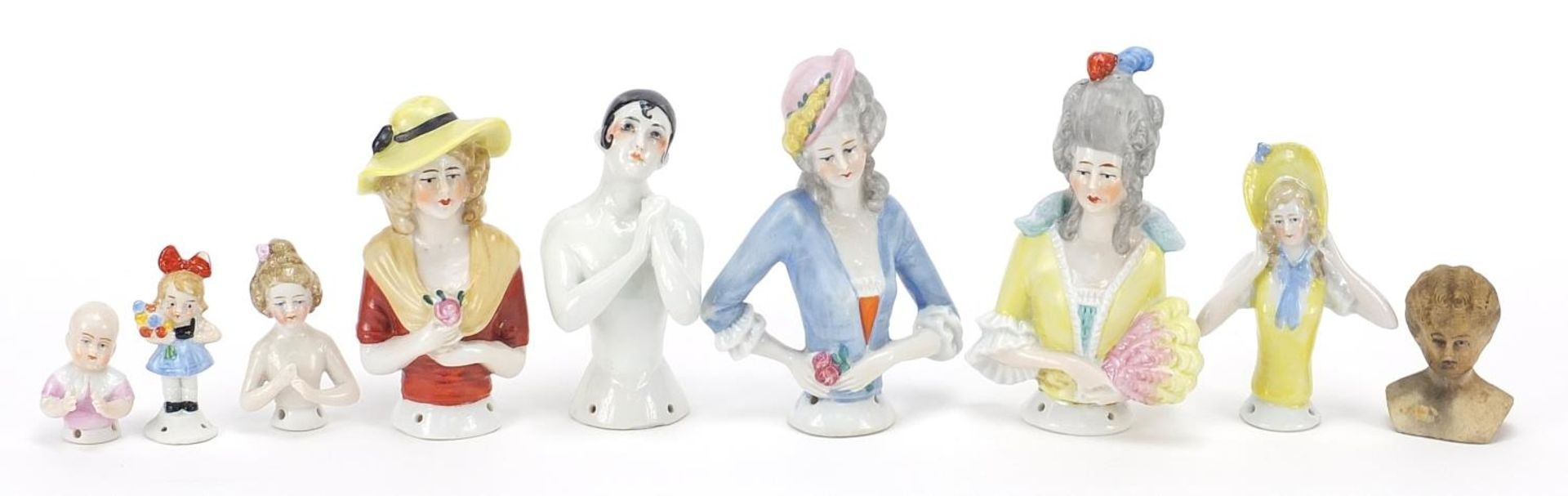 Group of porcelain half pin dolls, the largest 11cm high