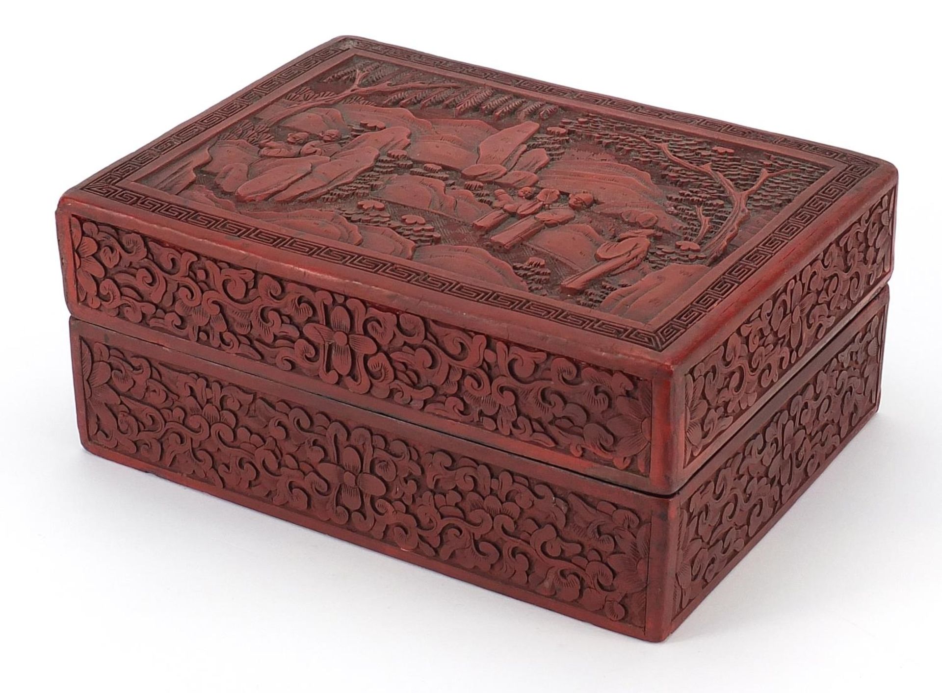 Large Chinese cinnabar lacquered box and cover carved with figures in a landscape and flowers,