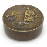 Japanese mixed metal box and cover decorated in relief with a figure and animals, character marks to