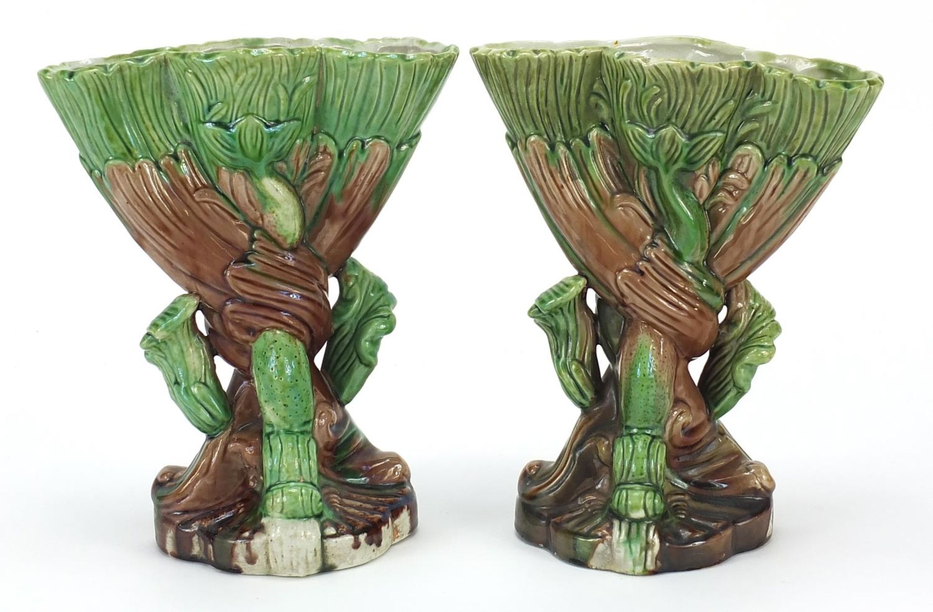 Pair of Victorian Majolica dolphin design vases, each 21 cm high