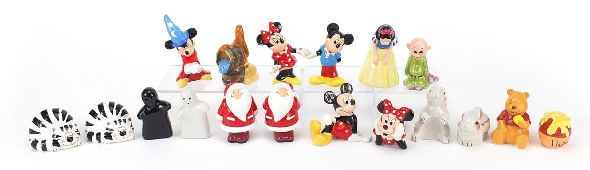 Collection of novelty salt and pepper shakers including Walt Disney Snow White, Mickey Mouse and