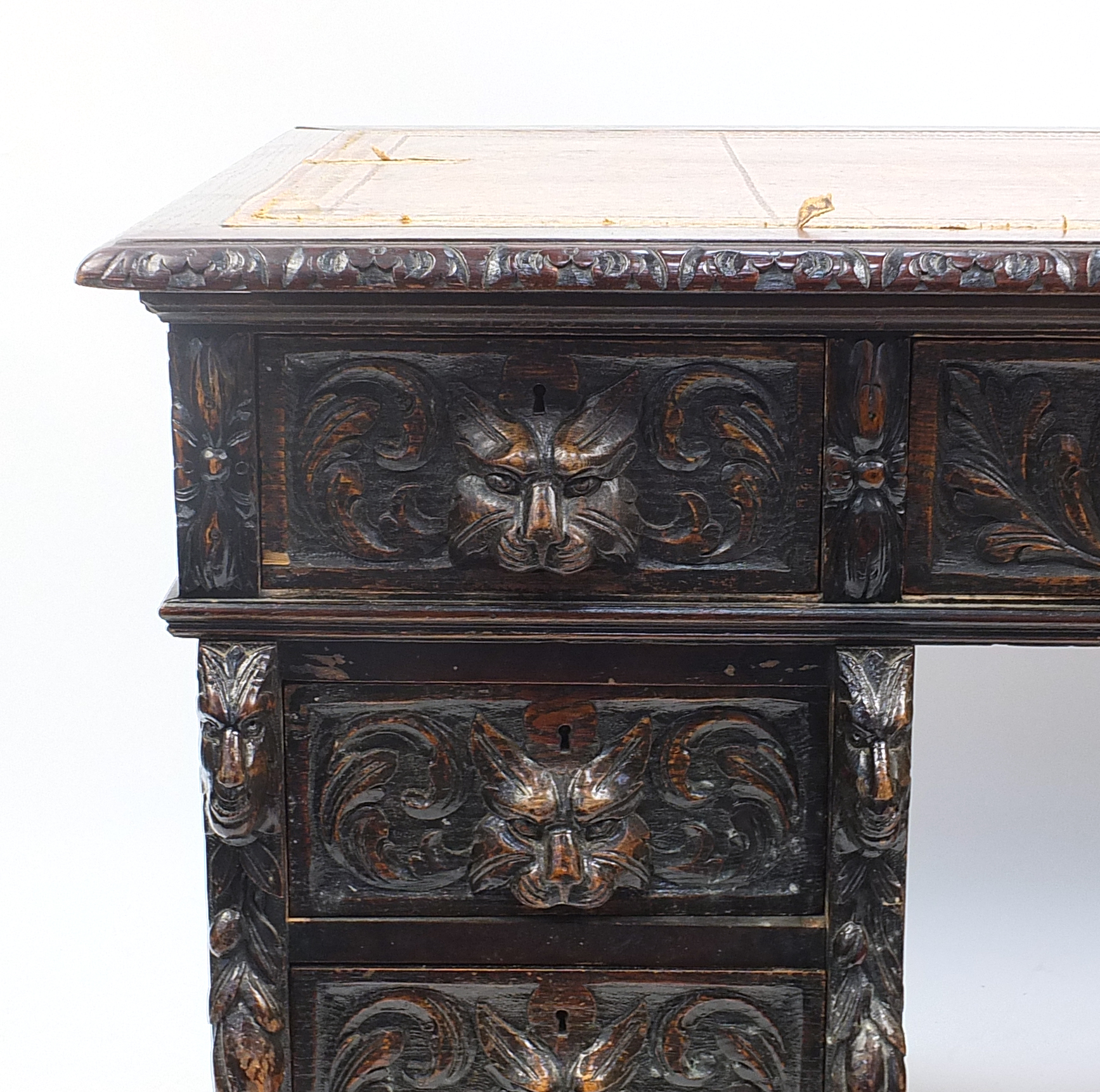 Oak twin pedestal desk with tooled leather top above a series of drawers, carved with lions heads, - Image 2 of 4