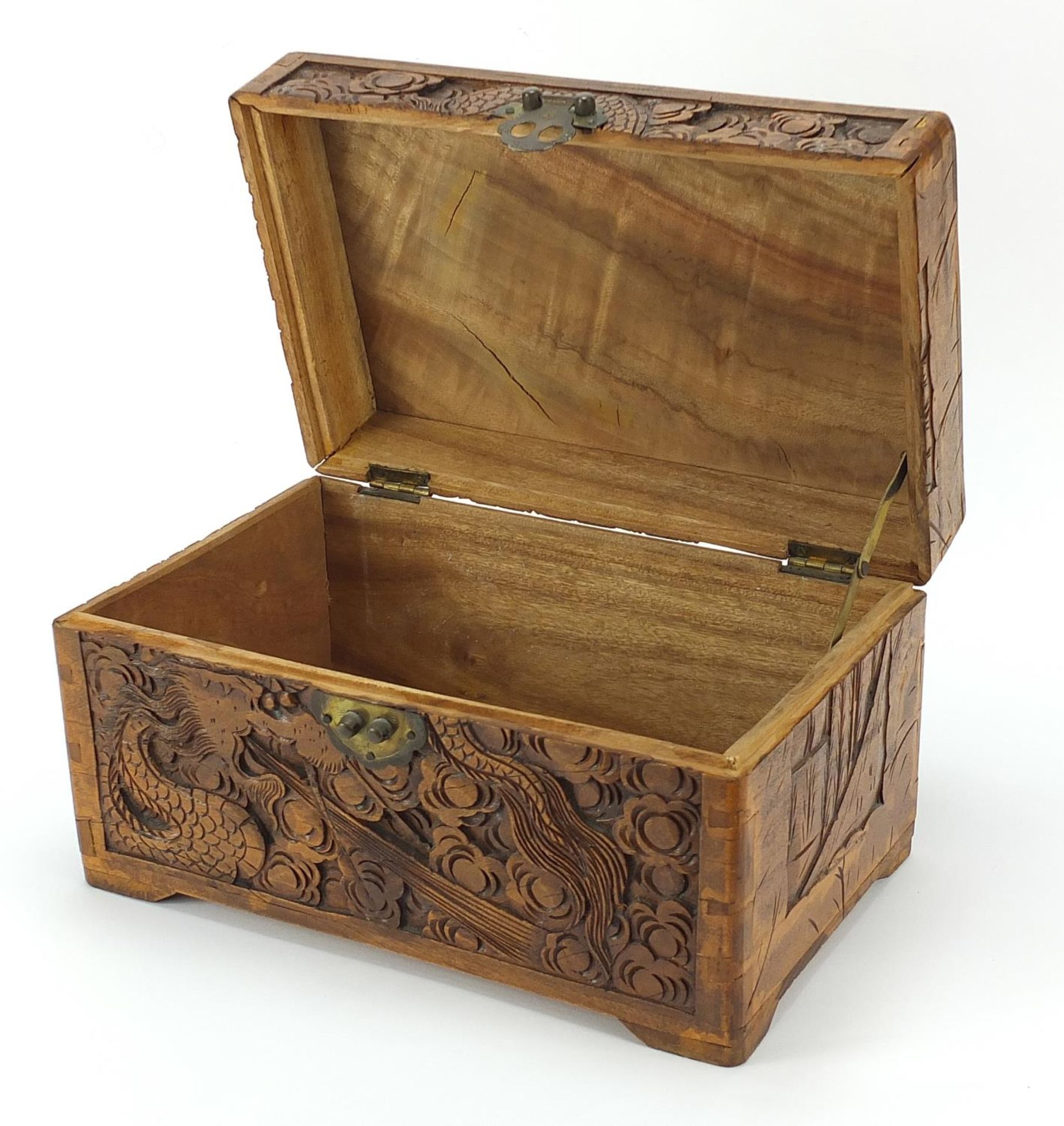 Chinese camphor wood table top chest carved with dragons amongst clouds, 17cm H x 30cm W x 19cm D - Image 2 of 4