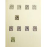 Collection of British stamps from Queen Victoria to Elizabeth II housed in a red album