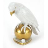 Hutschenreuther, German porcelain model of a parrot on a ball, 20.5cm high