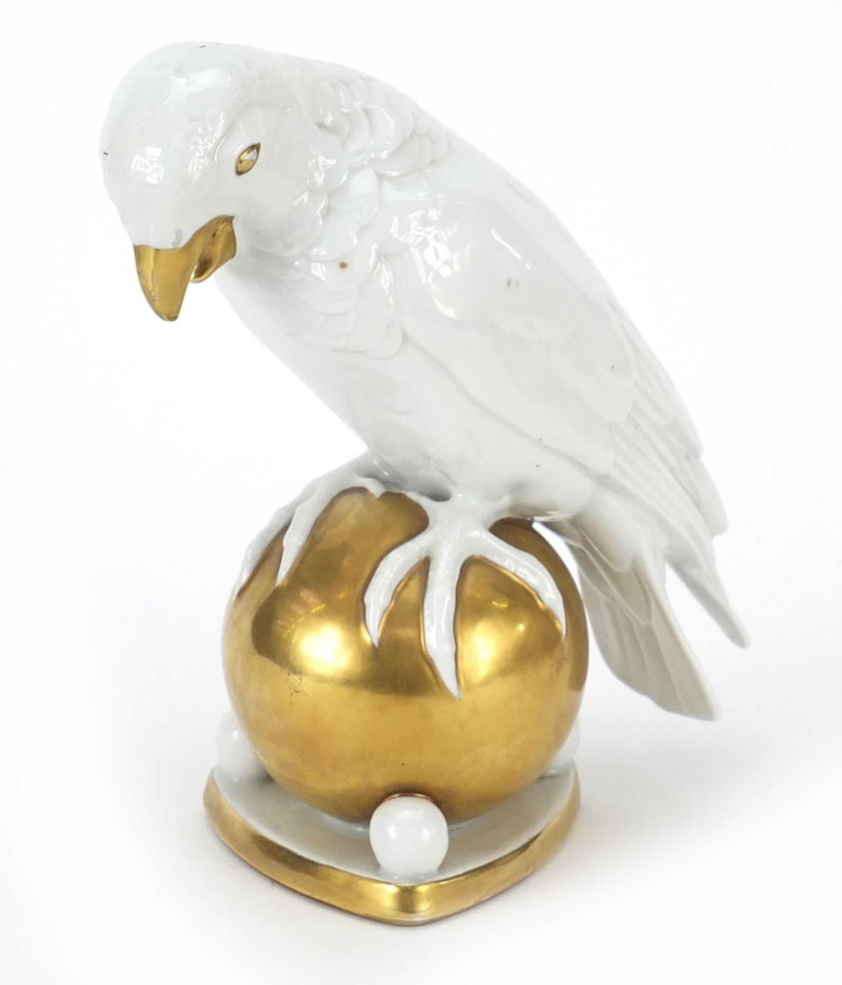 Hutschenreuther, German porcelain model of a parrot on a ball, 20.5cm high