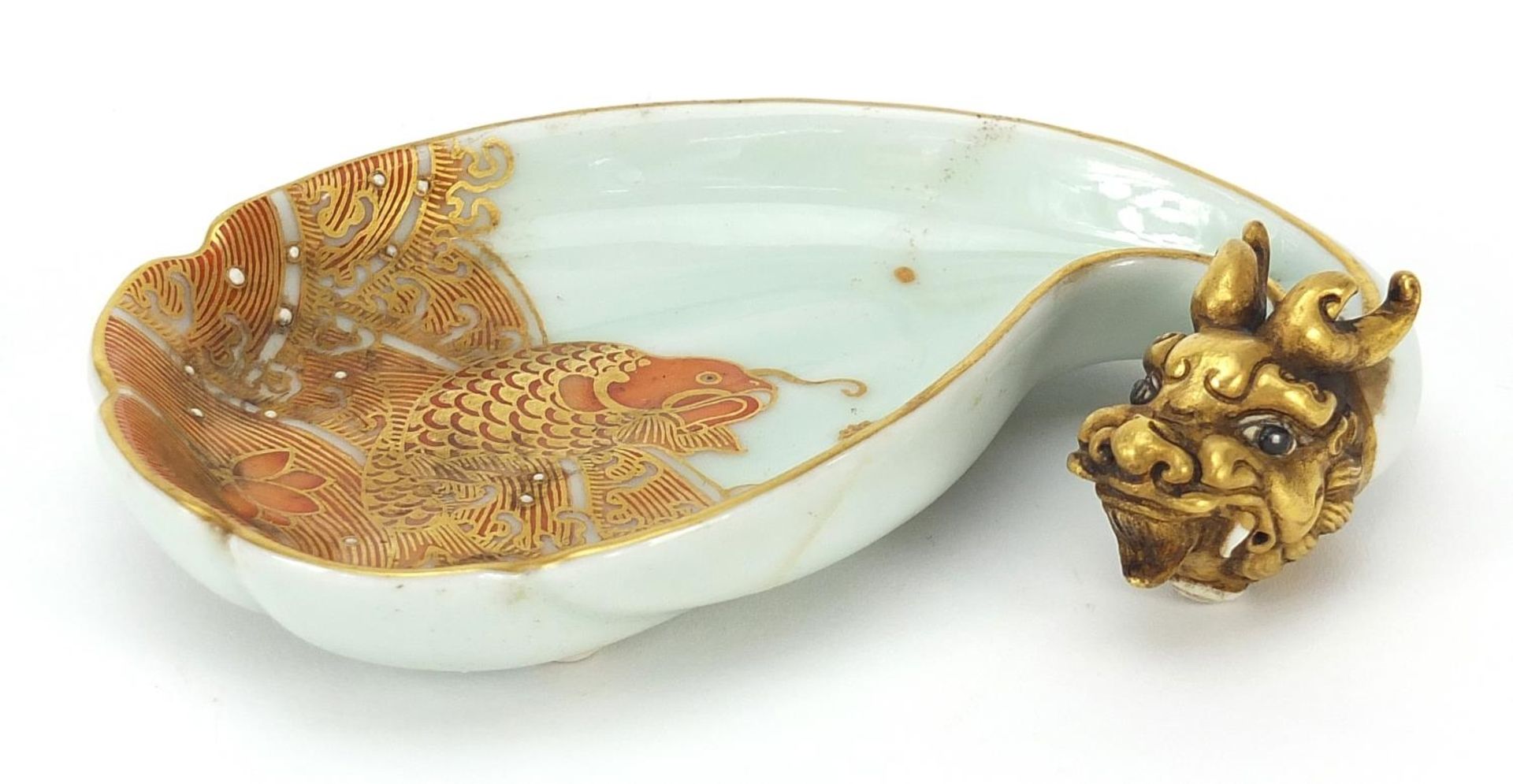 Chinese porcelain dish hand painted with a fish amongst waves and dragon head in relief, iron red