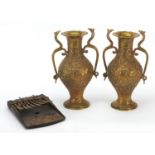 Pair of Indian brass vases with cobra handles and an African finger instrument