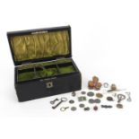 Costume jewellery including 9ct gold and silver arranged in a Victorian jewellery box, 20cm wide