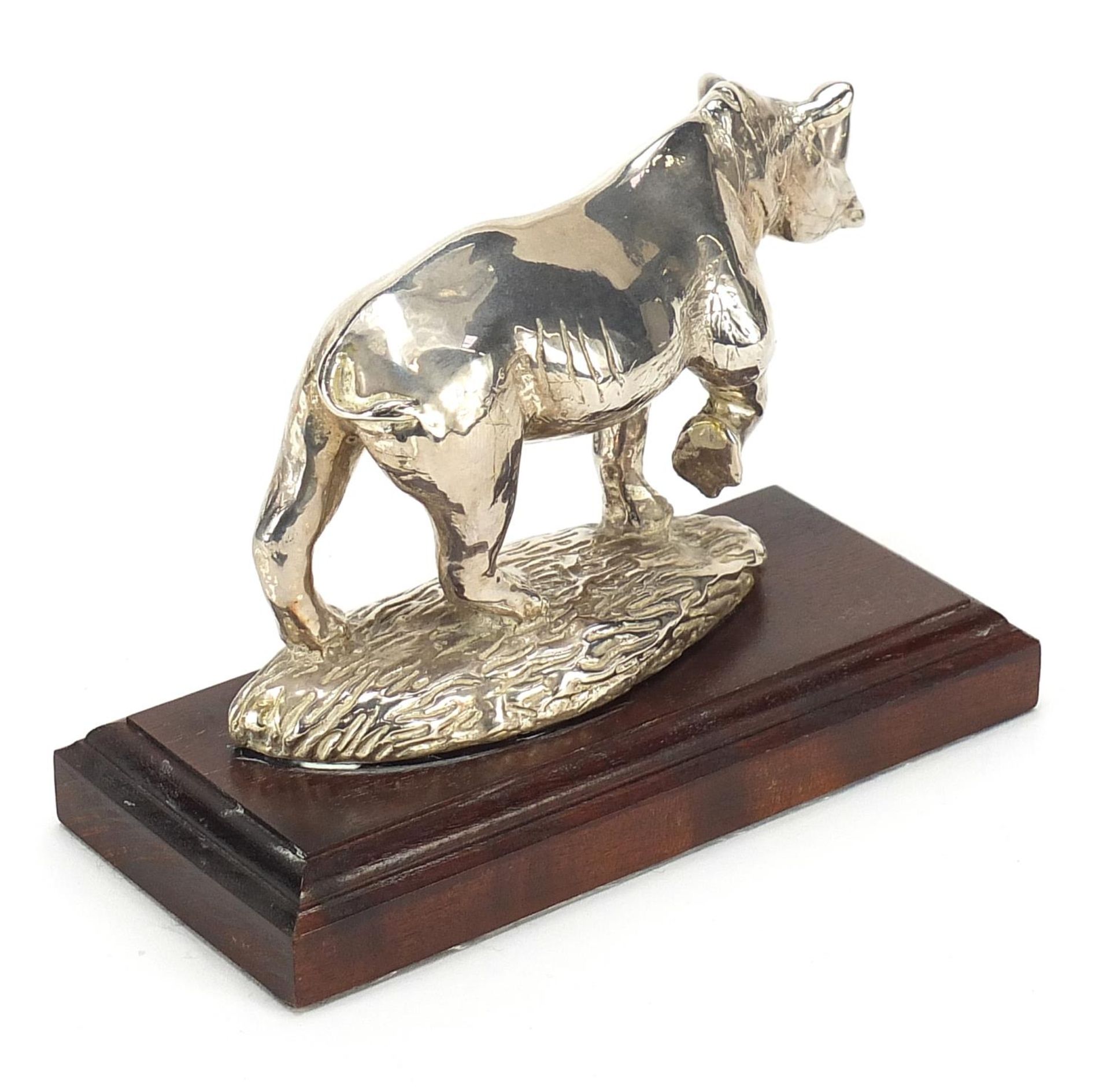 Afrisilver, African sterling silver filled rhinoceros, raised on a wooden base, 16cm in length - Image 2 of 4