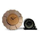 Two Art Deco clocks comprising a peach glass wall example in the form of a flower head and an