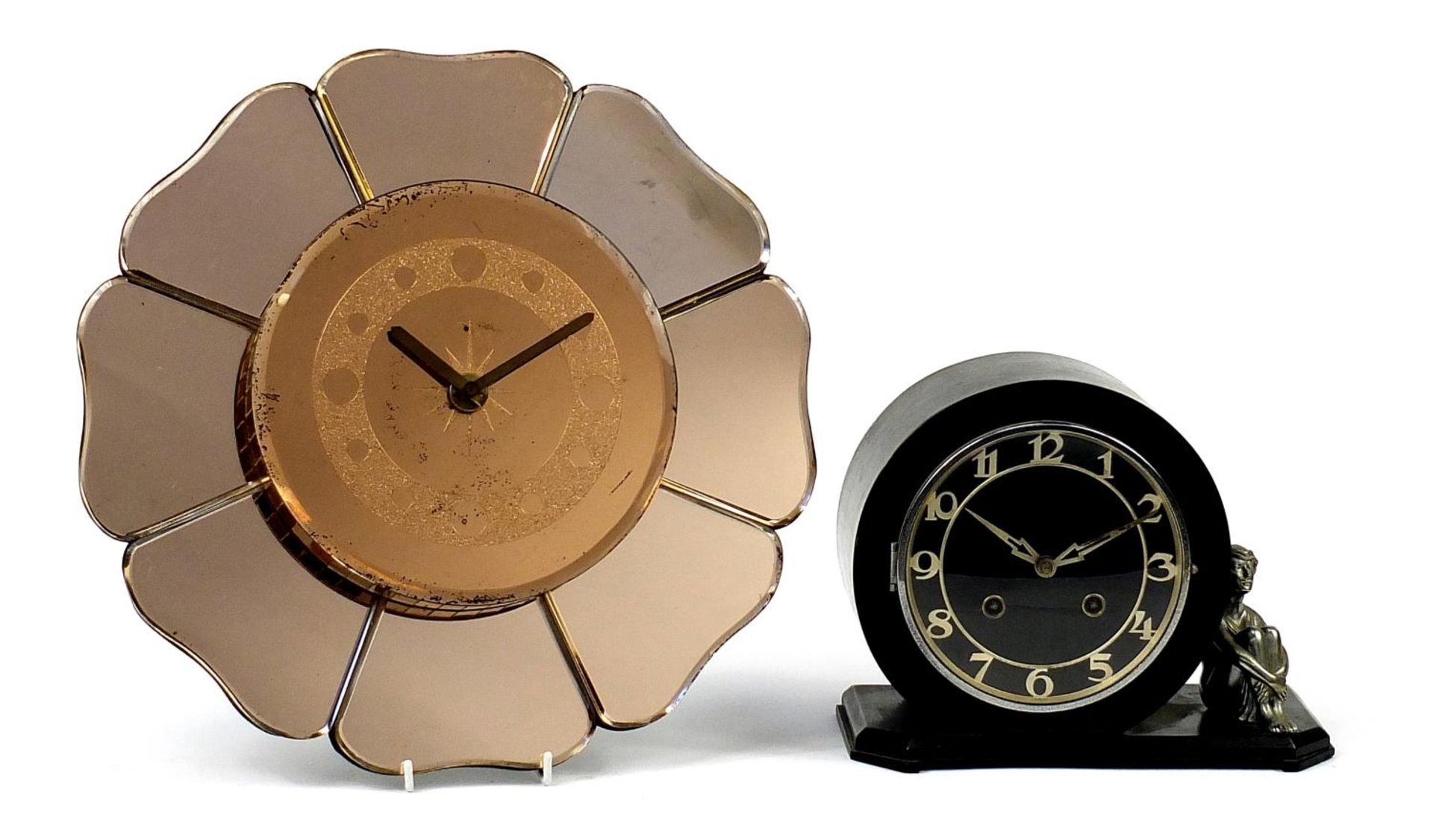 Two Art Deco clocks comprising a peach glass wall example in the form of a flower head and an