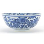 Chinese blue and white porcelain bowl hand painted with a dragon amongst flowers, four figure