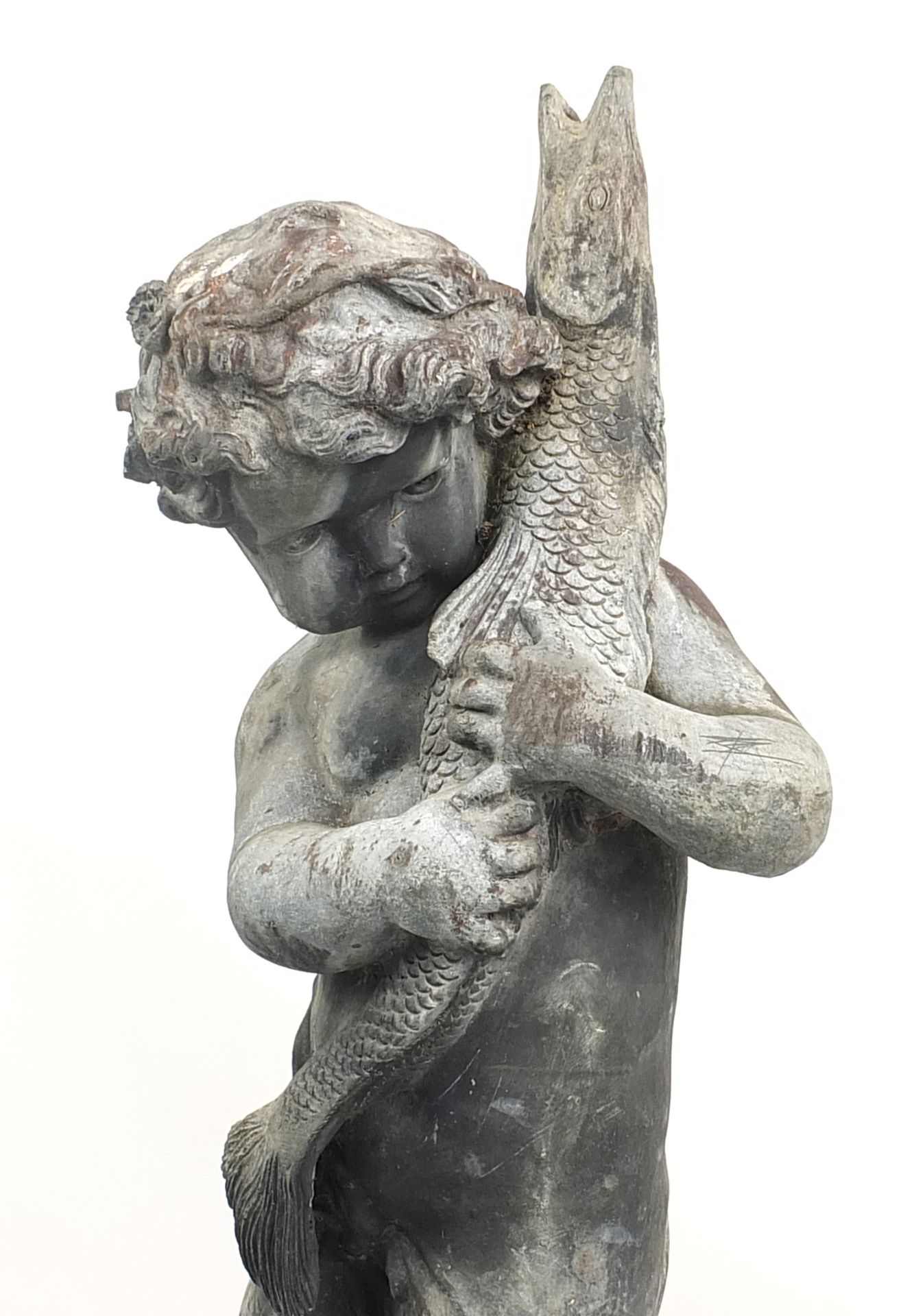 Lead garden water feature of Putti holding a fish, raised on a square concrete base, 145cm high - Image 2 of 3