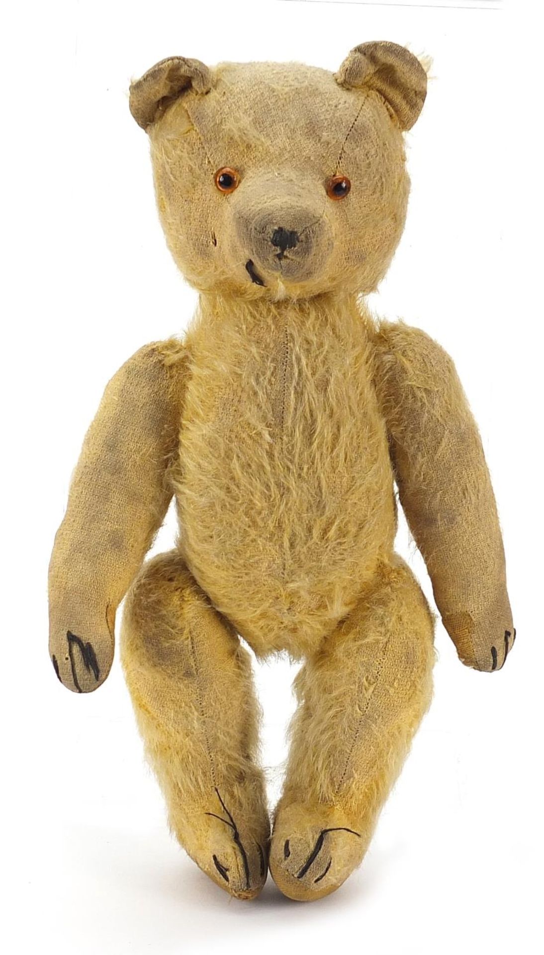 Antique golden straw filled teddy bear with articulated limbs, 29cm high